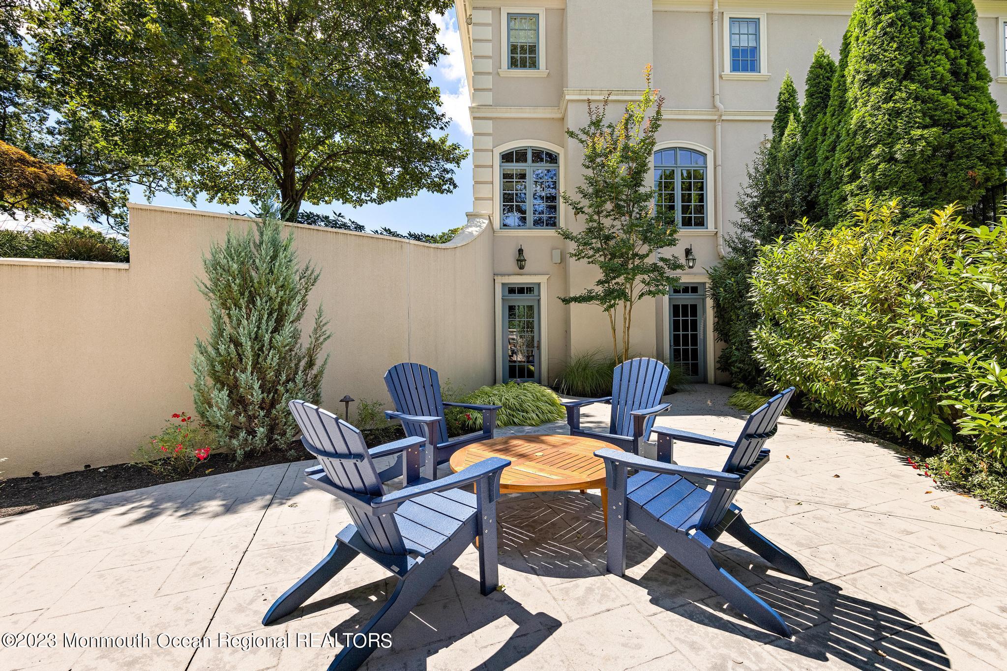 122 Rumson Road Rumson, NJ 07760 - Photo 79 of 100 a view of a chairs and table in patio
