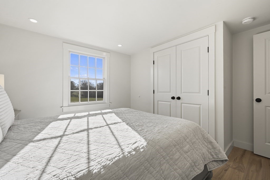 29 Mercier Way Edgartown, MA 02539 - Photo 14 of 29 a view of a bedroom with a bed and wooden floor