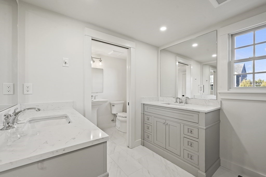 29 Mercier Way Edgartown, MA 02539 - Photo 16 of 29 a bathroom with a sink double vanity and a mirror
