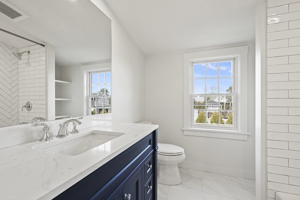 29 Mercier Way Edgartown, MA 02539 - Photo 18 of 29 a bathroom with a granite countertop sink toilet and shower