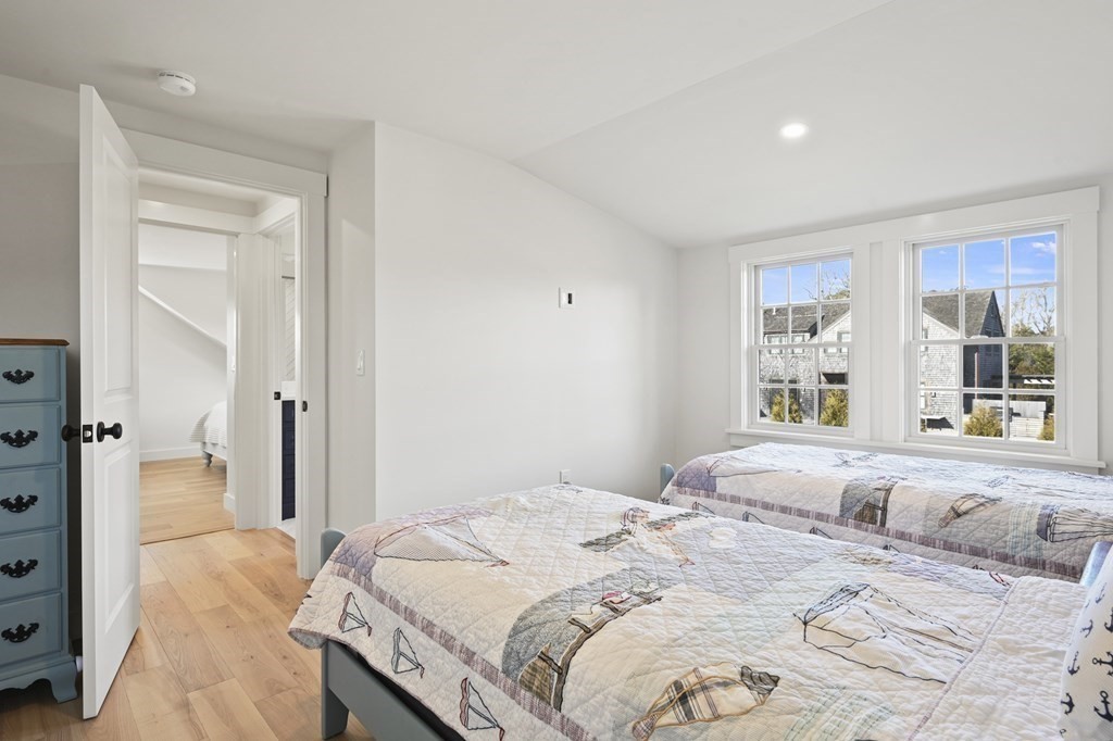 29 Mercier Way Edgartown, MA 02539 - Photo 20 of 29 a bedroom with a large bed and a window