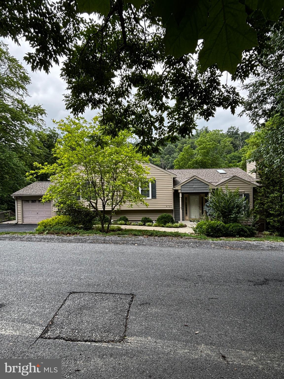6720 West Lakeridge Road New Market, MD 21774 - Photo 1 of 1 Charming home nestled among trees.