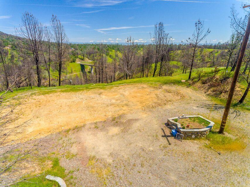 6950 Placer Road Igo, CA 96047 - Photo 11 of 25 a view of a swimming pool with an outdoor space and seating area
