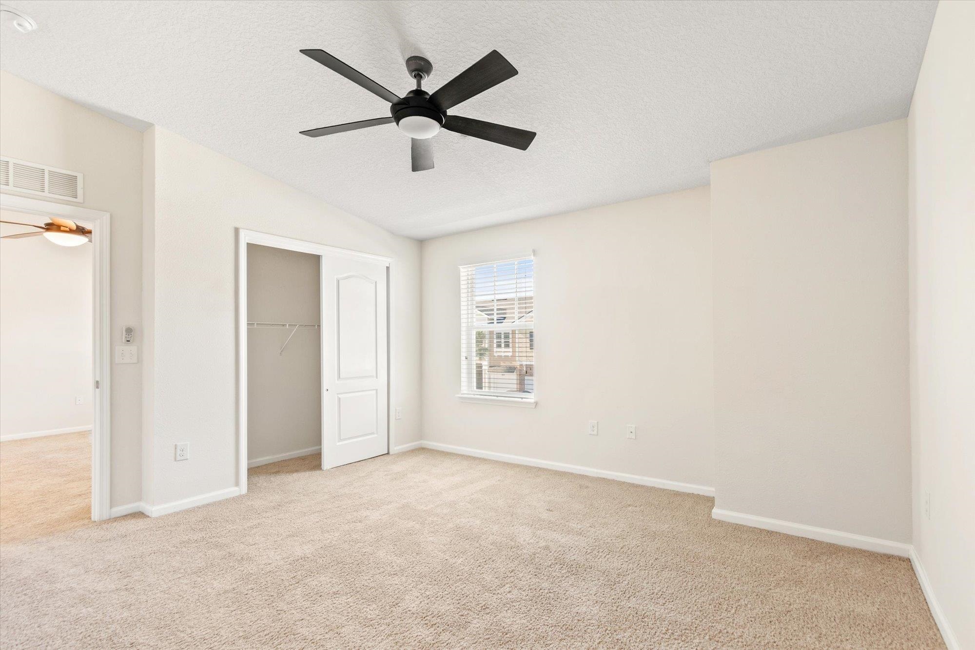 1511 Golden Lake Loop St. Augustine, FL 32084 - Photo 12 of 30 an empty room with ceiling fan and window