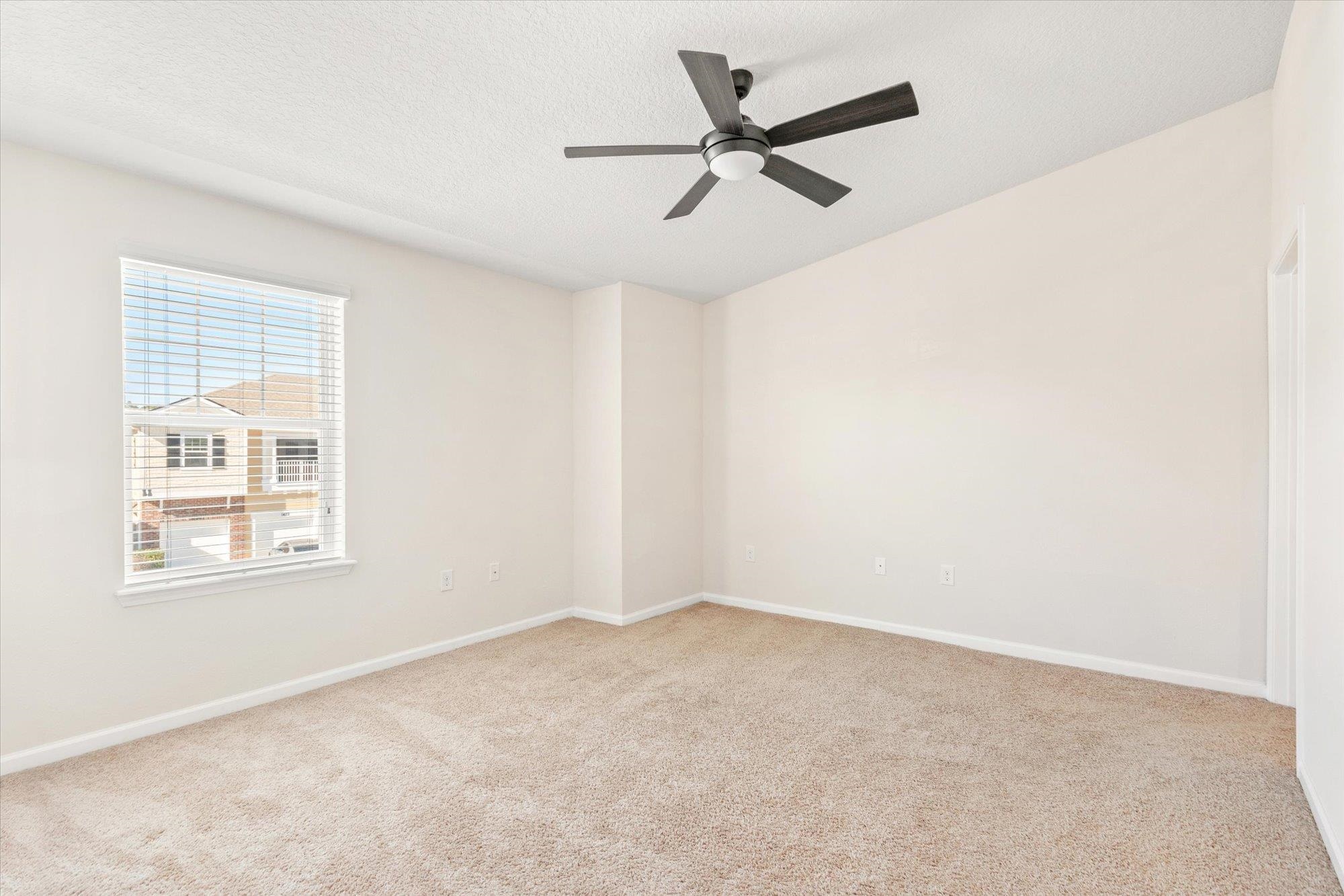 1511 Golden Lake Loop St. Augustine, FL 32084 - Photo 13 of 30 an empty room with a window and a fan