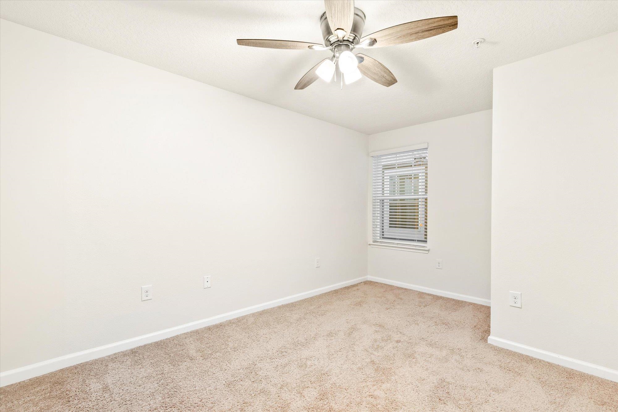 1511 Golden Lake Loop St. Augustine, FL 32084 - Photo 15 of 30 an empty room with a window and a fan