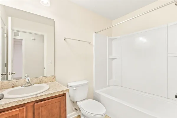 a view of a porch with a door and a window