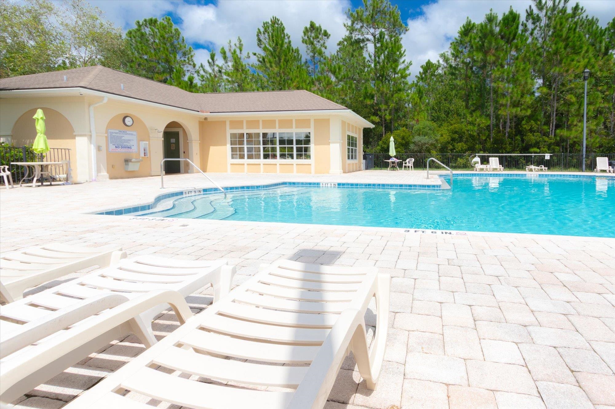1511 Golden Lake Loop St. Augustine, FL 32084 - Photo 27 of 30 a view of a white house with a yard
