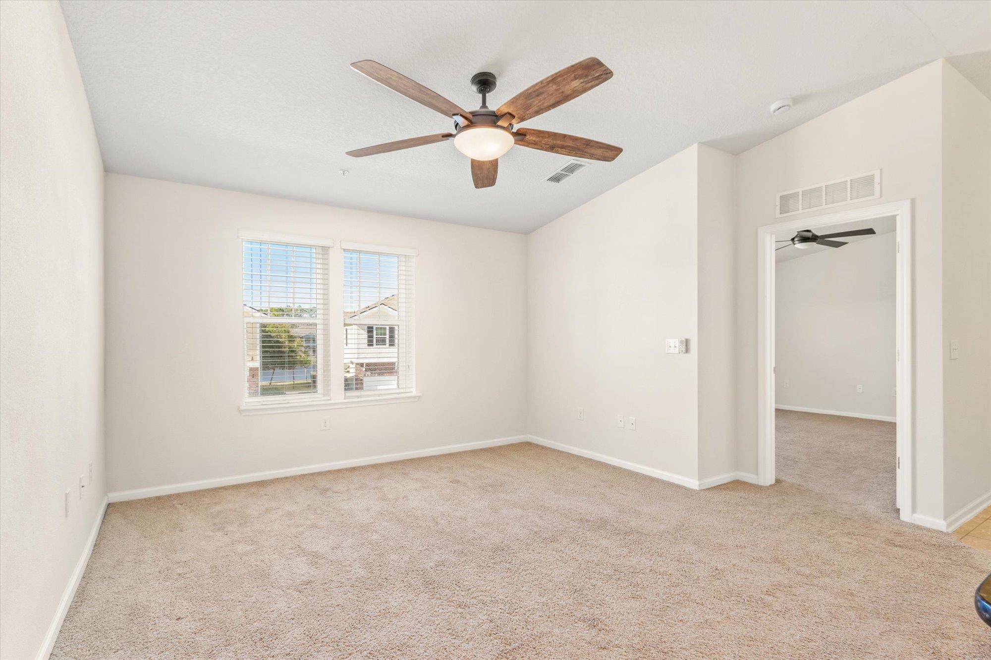 1511 Golden Lake Loop St. Augustine, FL 32084 - Photo 9 of 30 wooden floor in an empty room with a window
