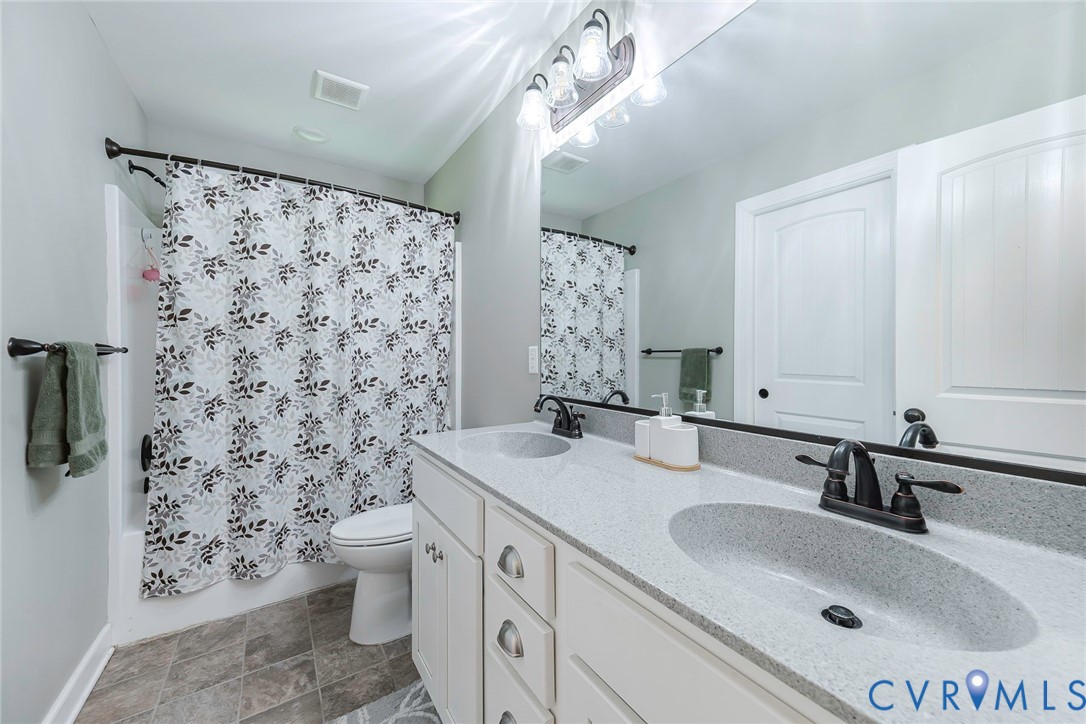 19151 Poor House Road Amelia Court House, VA 23002 - Photo 23 of 39 Dual vanity with integrated sinks and dark bronze