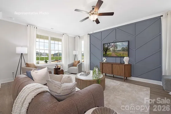 a living room with furniture and a flat screen tv