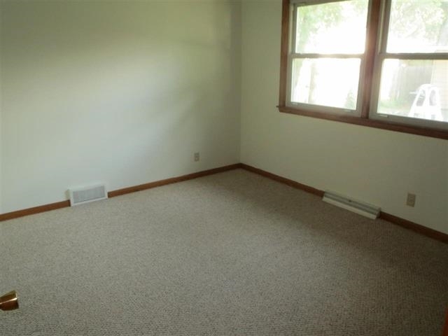 6103 Park Ridge Road Loves Park, IL 61111 - Photo 11 of 22 an empty room with a window