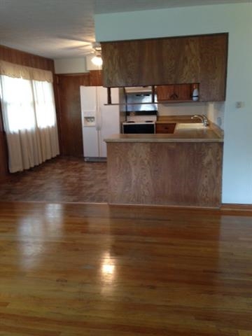 6103 Park Ridge Road Loves Park, IL 61111 - Photo 13 of 22 a kitchen with a sink and a stove top oven