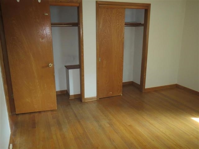 6103 Park Ridge Road Loves Park, IL 61111 - Photo 18 of 22 a view of empty room with wooden floor