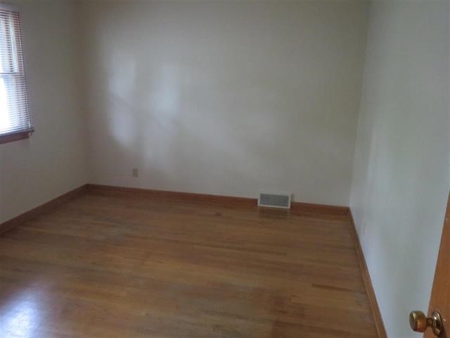 6103 Park Ridge Road Loves Park, IL 61111 - Photo 19 of 22 an empty room with a window