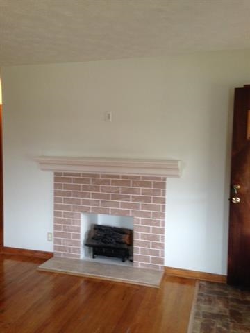 6103 Park Ridge Road Loves Park, IL 61111 - Photo 3 of 22 a room with a fireplace