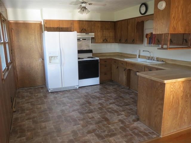 6103 Park Ridge Road Loves Park, IL 61111 - Photo 9 of 22 a kitchen with stainless steel appliances granite countertop a refrigerator sink and stove