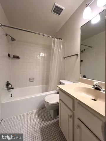 a bathroom with a sink a toilet and a bathtub