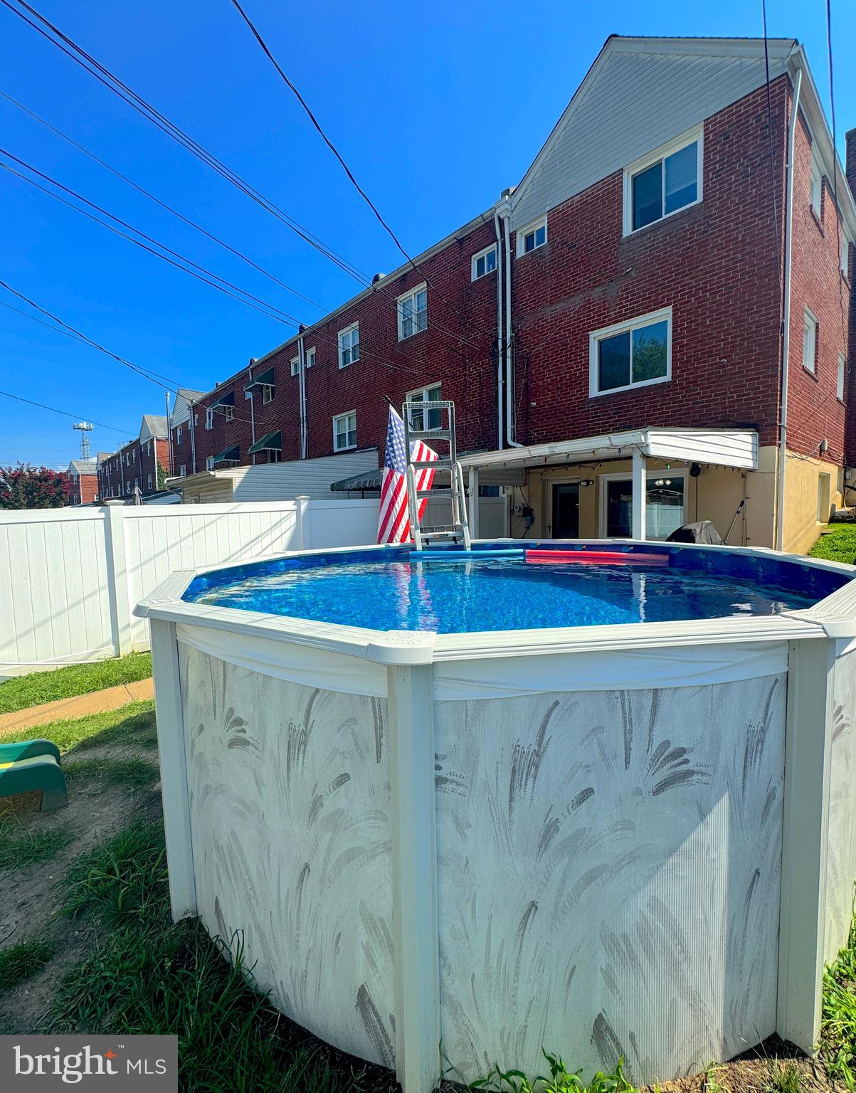 2328 Searles Road Dundalk, MD 21222 - Photo 31 of 36 a view of a swimming pool with an outdoor seating