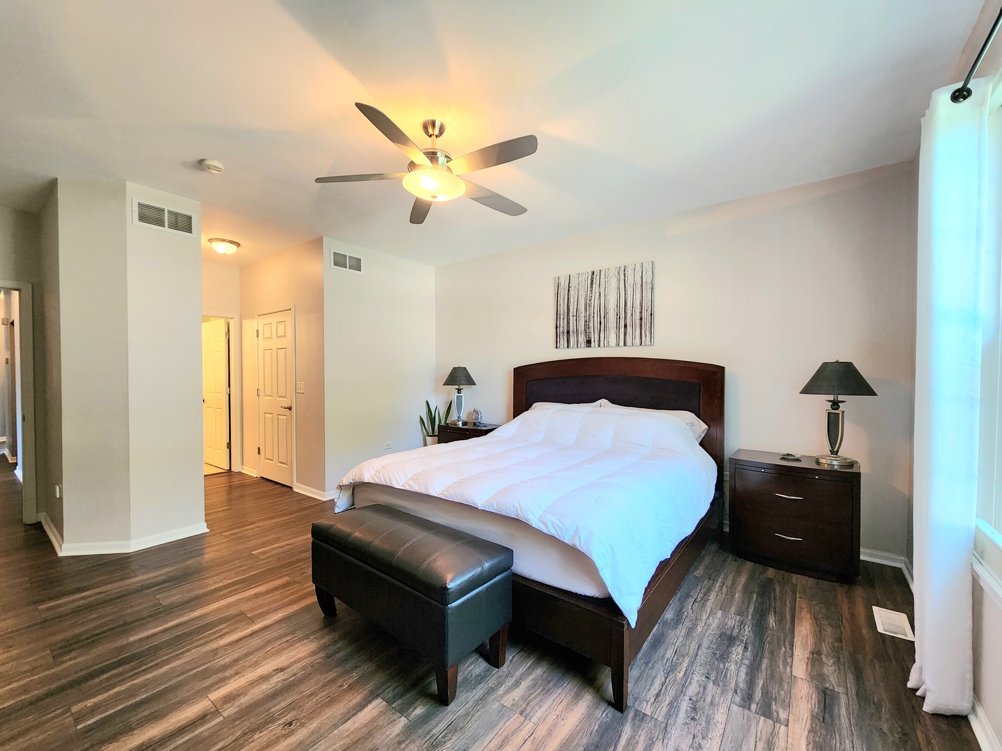 982 Oak Ridge Boulevard Elgin, IL 60120 - Photo 15 of 27 a bedroom with a bed and wooden floor