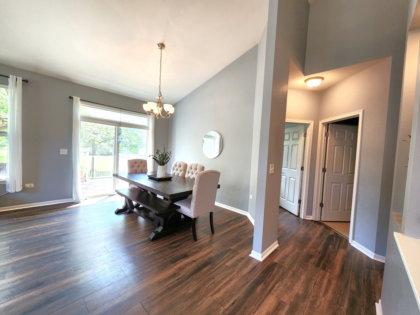 982 Oak Ridge Boulevard Elgin, IL 60120 - Photo 7 of 27 a living room with furniture a window and a chandelier