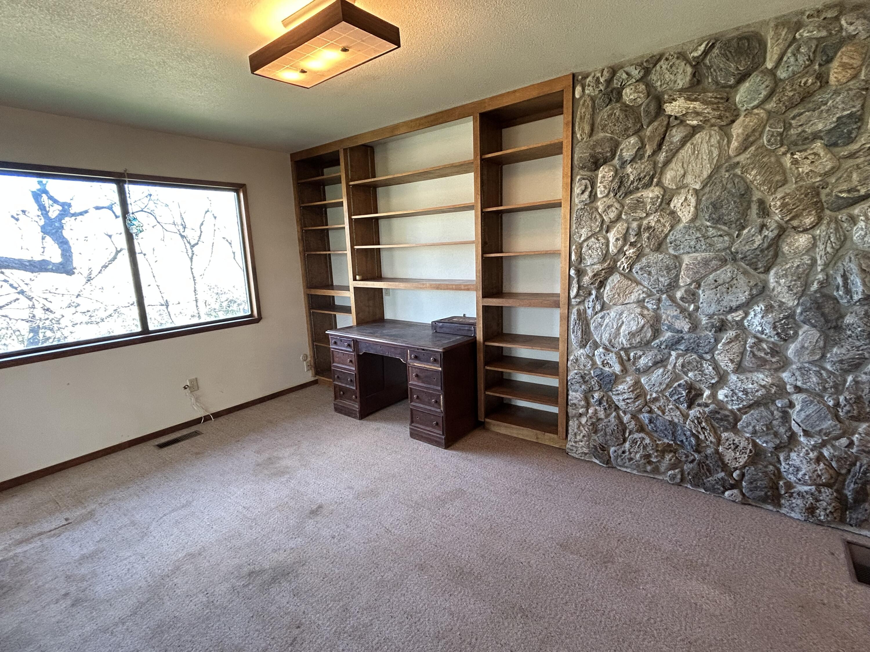 40838 Oak Ridge Drive Three Rivers, CA 93271 - Photo 24 of 51 an empty room with furniture and a window