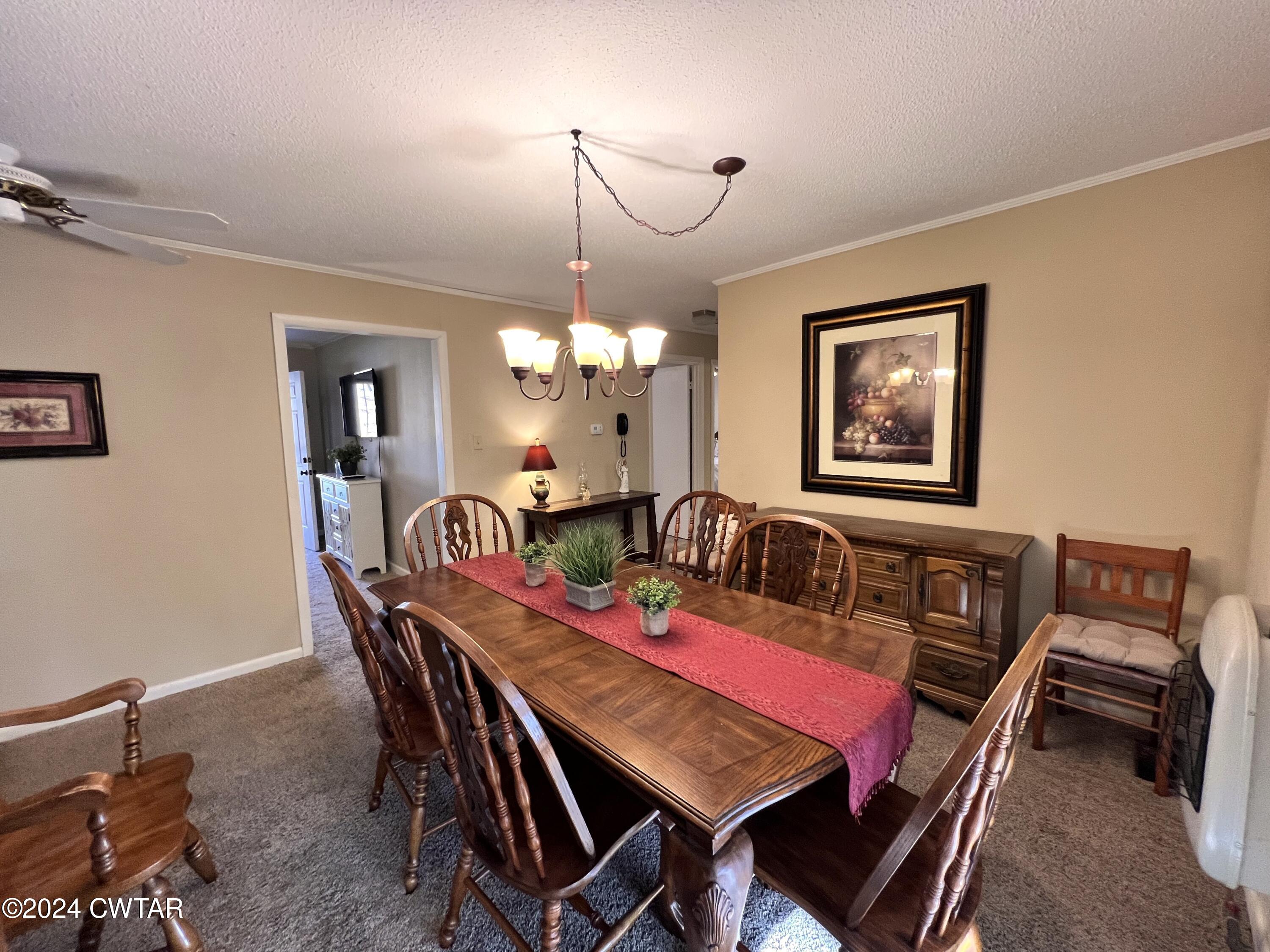 2390 Harts Bridge Road Jackson, TN 38301 - Photo 8 of 36 a view of a dining room with furniture