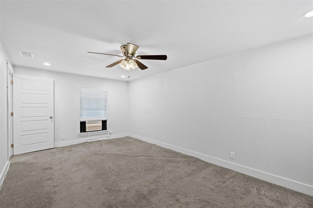 3514 Larry Street Rowlett, TX 75088 - Photo 12 of 27 an empty room with closet and windows