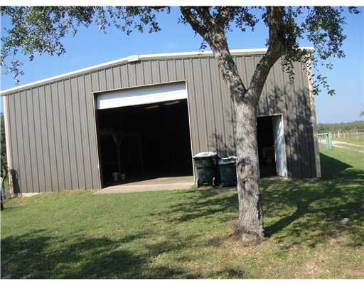157 Quail Ridge Drive Beeville, TX 78102 - Photo 2 of 9 a front view of a house with a yard