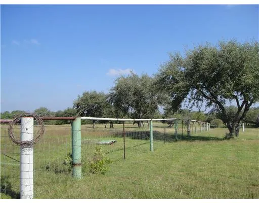 a view of a lake with houses in the background