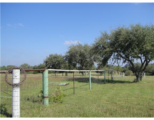 157 Quail Ridge Drive Beeville, TX 78102 - Photo 4 of 9 a view of a lake with houses in the background