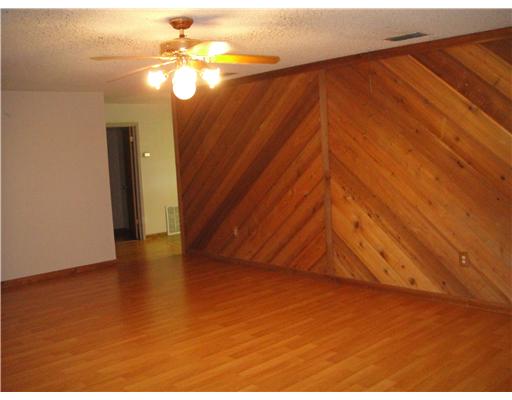 157 Quail Ridge Drive Beeville, TX 78102 - Photo 6 of 9 a view of an empty room and chandelier fan