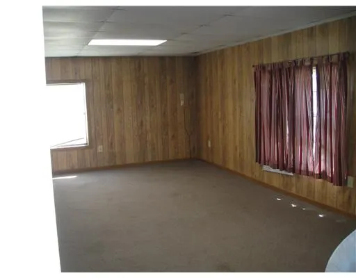 a view of a room with a wooden door