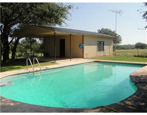 a view of a house with a swimming pool