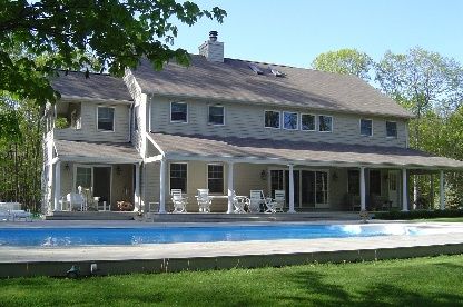 a view of house with a swimming pool