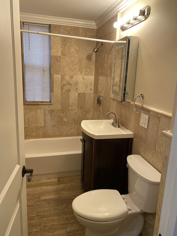 8 Buckley Avenue, Unit 2 Boston, MA 02130 - Photo 6 of 8 a bathroom with a sink a toilet a mirror and shower