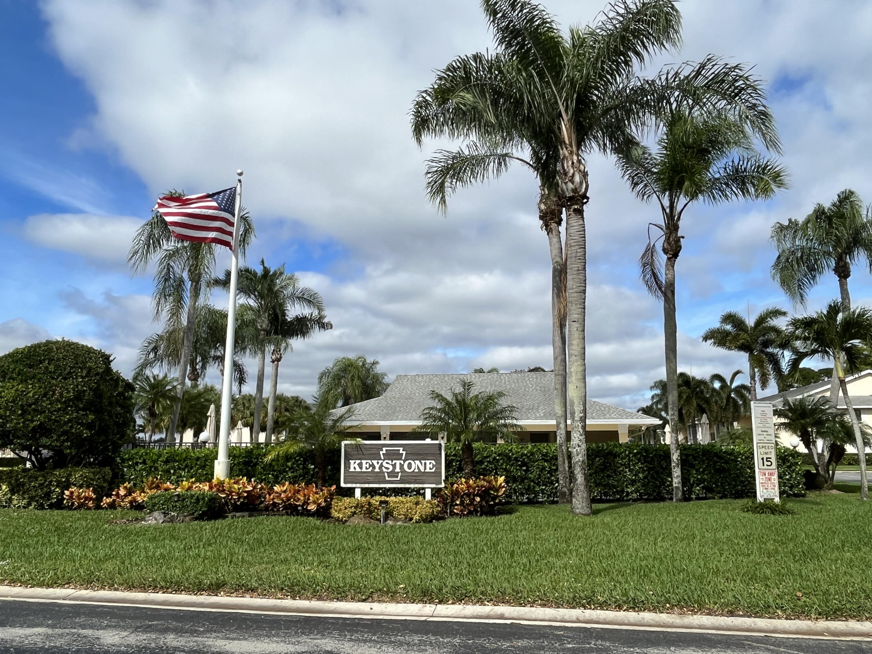 Community entrance, pool, and clubhouse