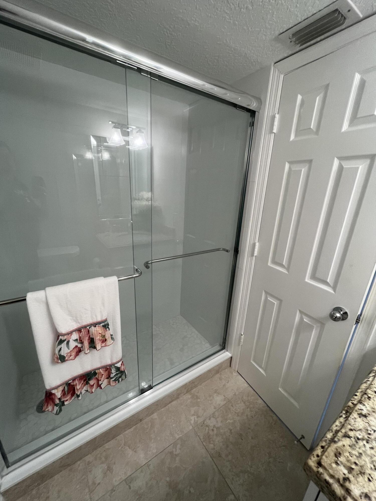 2041 Keystone Drive, Unit B Jupiter, FL 33458 - Photo 13 of 17 2nd Bathroom Shower