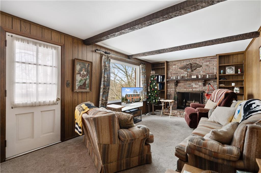 43 Jaycee Drive Pittsburgh, PA 15243 - Photo 13 of 38 a living room with furniture a large window and a flat screen tv
