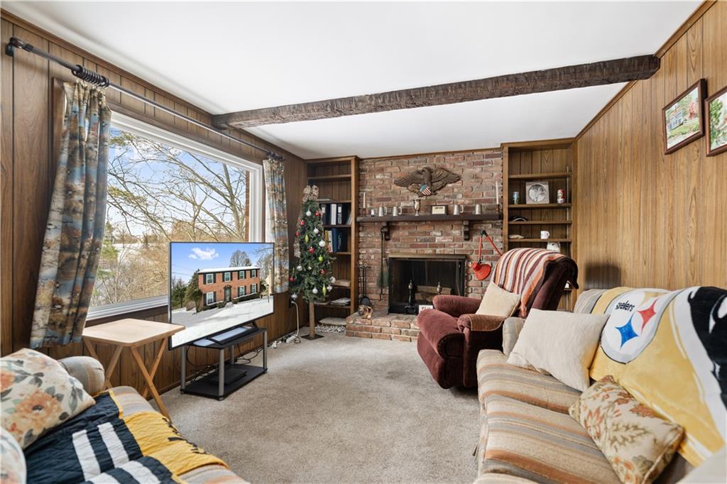 43 Jaycee Drive Pittsburgh, PA 15243 - Photo 14 of 38 a living room with furniture a fireplace and a large window