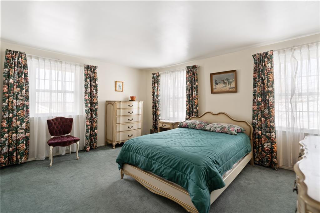 43 Jaycee Drive Pittsburgh, PA 15243 - Photo 18 of 38 a bedroom with a bed chair and a window