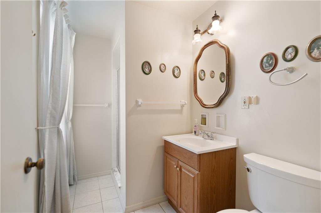 43 Jaycee Drive Pittsburgh, PA 15243 - Photo 20 of 38 a bathroom with a sink and a mirror