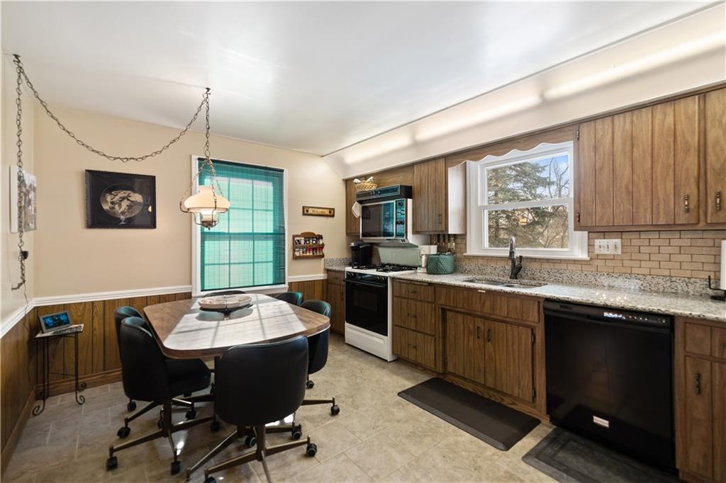43 Jaycee Drive Pittsburgh, PA 15243 - Photo 9 of 38 a large kitchen with a table and chairs in it