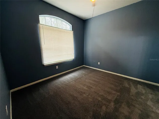 a bathroom with a sink a toilet a mirror and shower