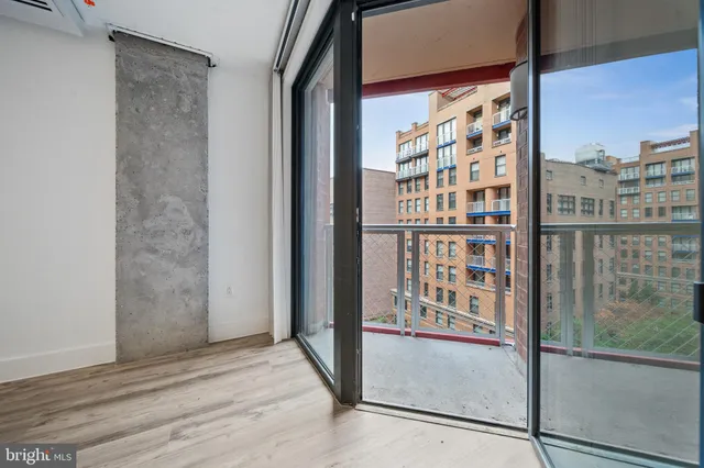 wooden floor windows and entryway in a room