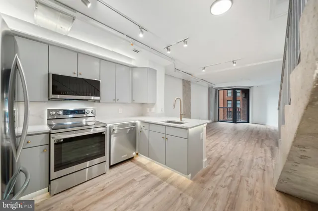 a kitchen with a stove and a microwave