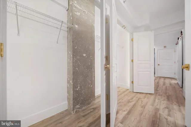 a building outdoor space with patio furniture and potted plants