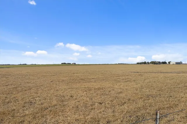 an aerial view of a house with outdoor space