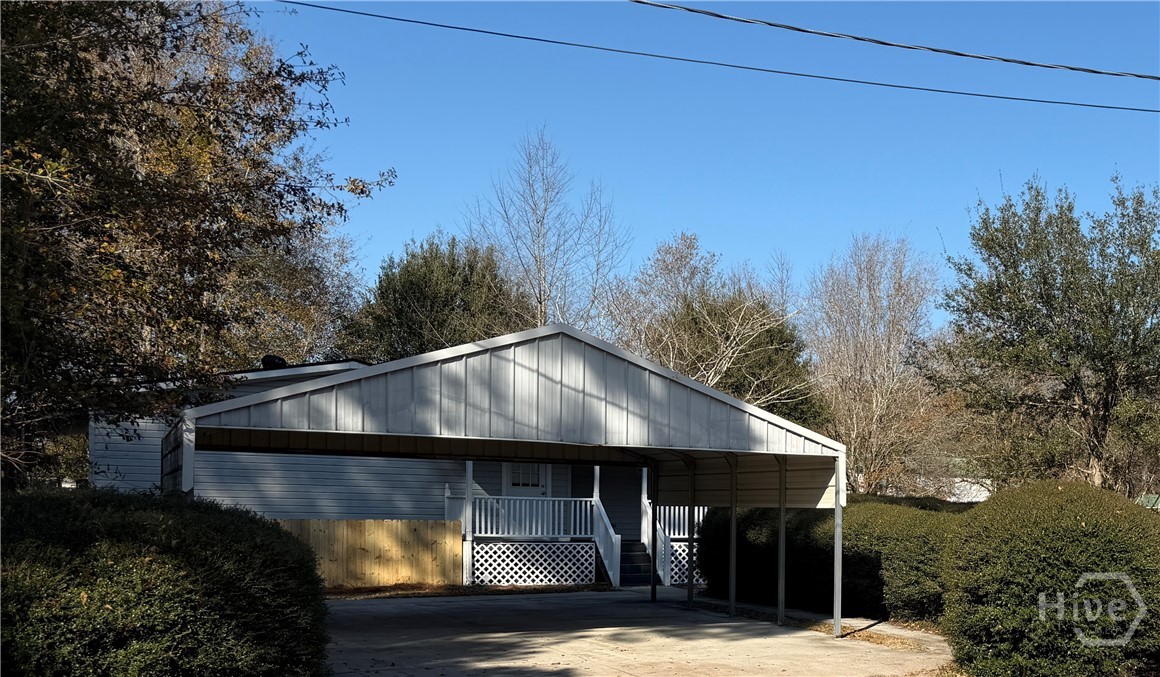 150 Maple Drive Ellabell, GA 31308 - Photo 34 of 42 Side Entry Carport - Covered Deck