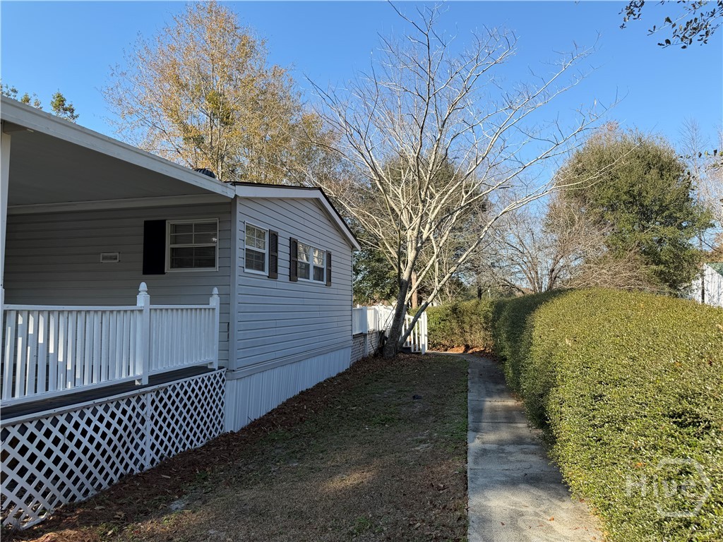 150 Maple Drive Ellabell, GA 31308 - Photo 35 of 42 Side Entry Covered Deck - Sidewalk To Front Door & Deck